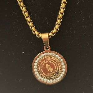 Prayer of serenity in front, Our Father prayer in back, gold tone.